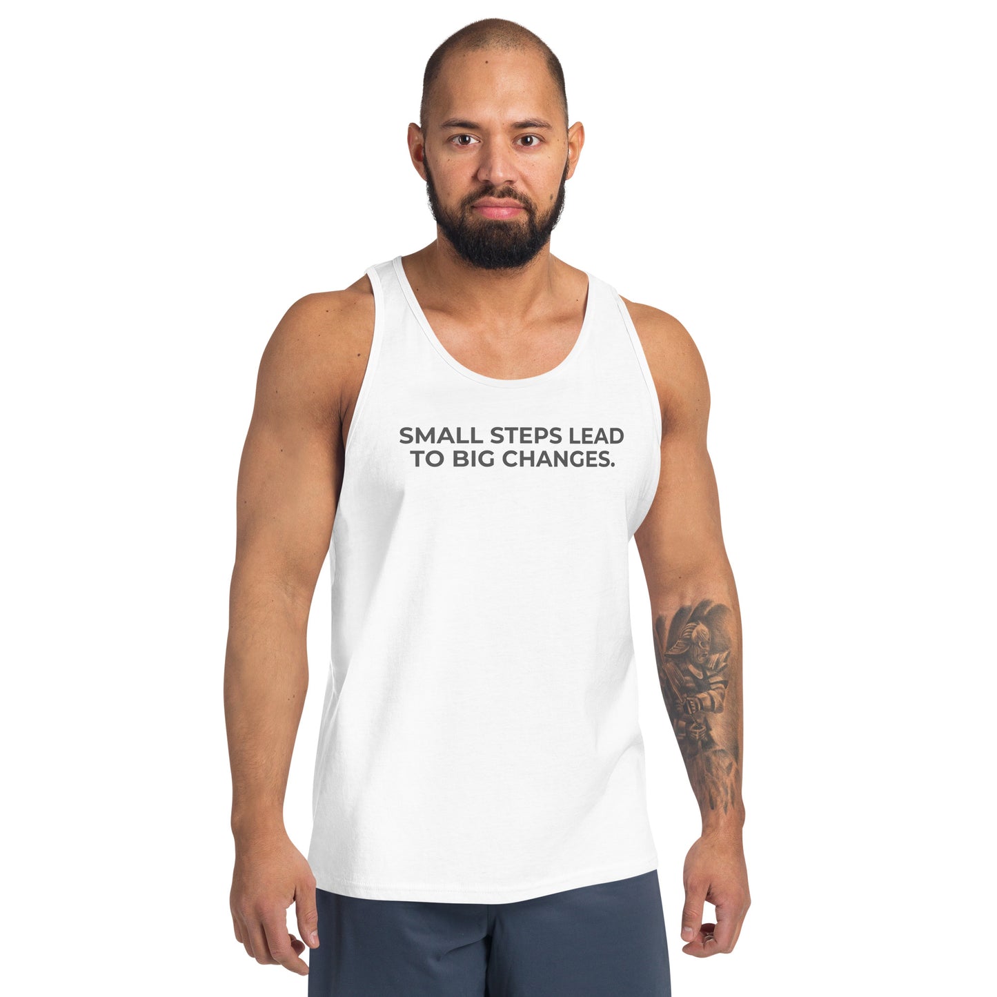 Man wearing a white sleeveless tank with "Small Steps Lead to Big Changes" text.