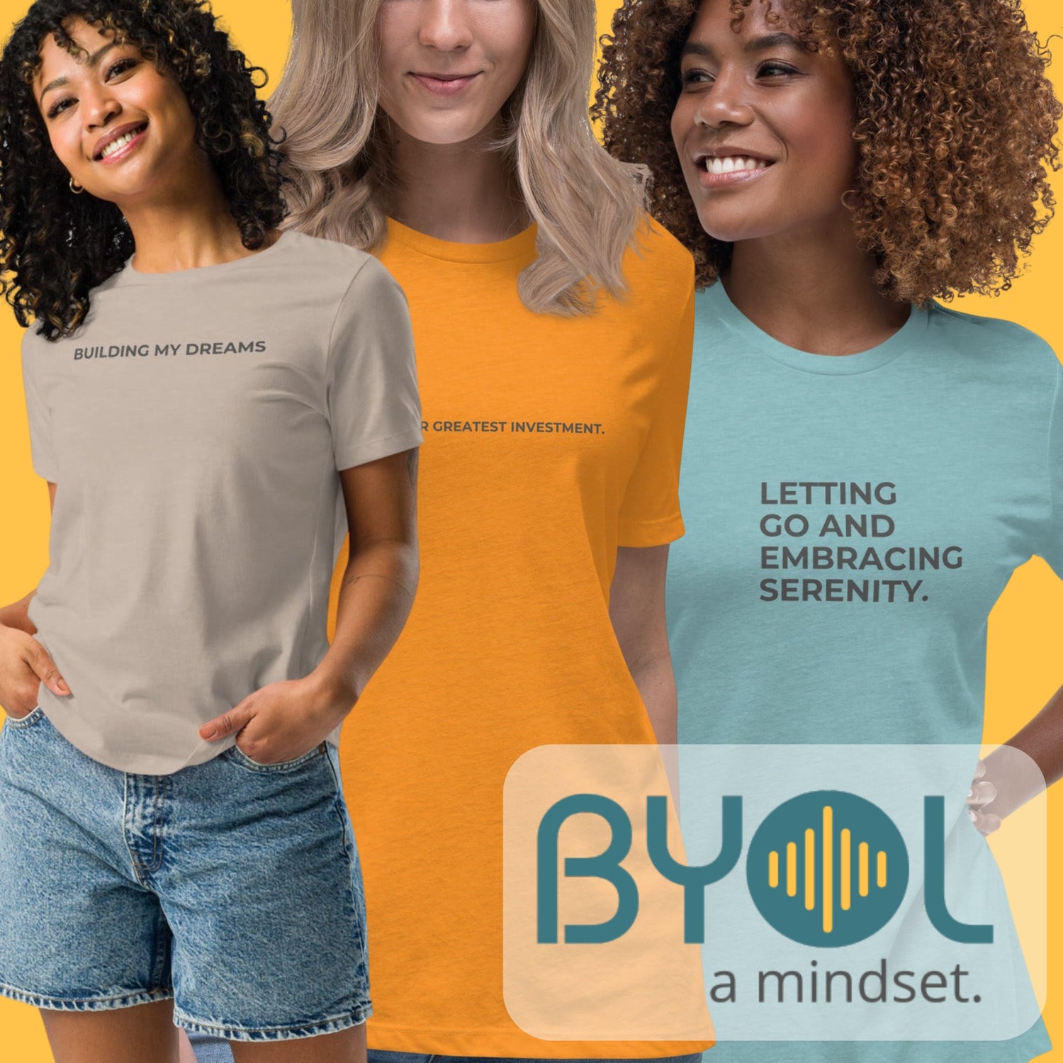 Three women wearing Be You Out Loud t-shirts with empowering phrases like "Building My Dreams" and "Letting Go and Embracing Serenity." The BYOL logo is visible in the corner against a yellow background.