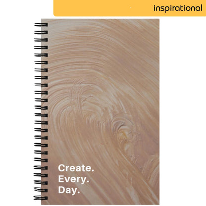 A notepad with a creamy, textured background resembling a swirl of paint, with the encouraging words 'Create. Every. Day.' in bold, spaced-out lettering, suggesting a call to embrace daily creativity and artistic expression.