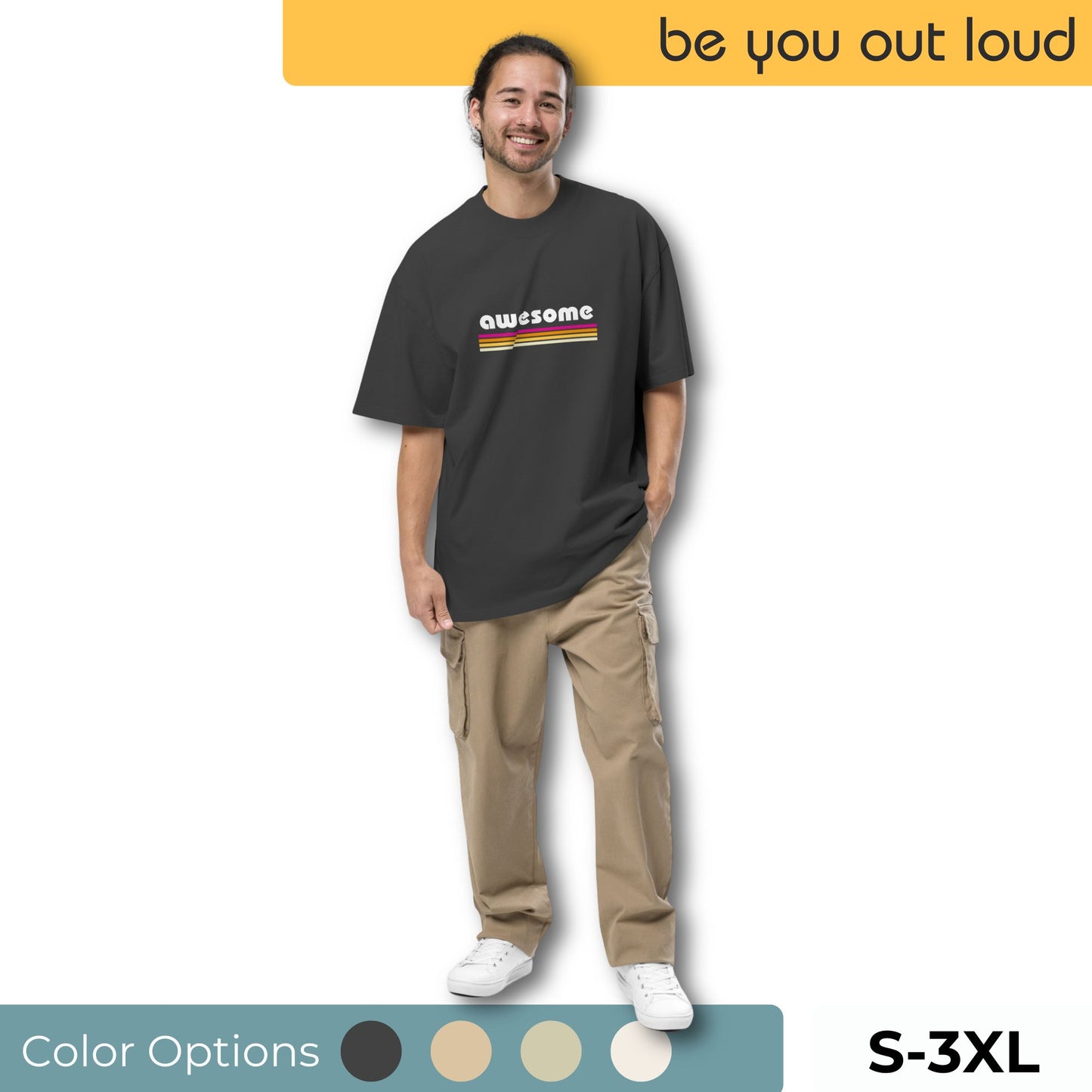 Man wearing Be You Out Loud Men's "Retro Awesome" Oversized Graphic Tee in black with a colorful striped design spelling out 'awesome', available in sizes S-3XL and a selection of color options.