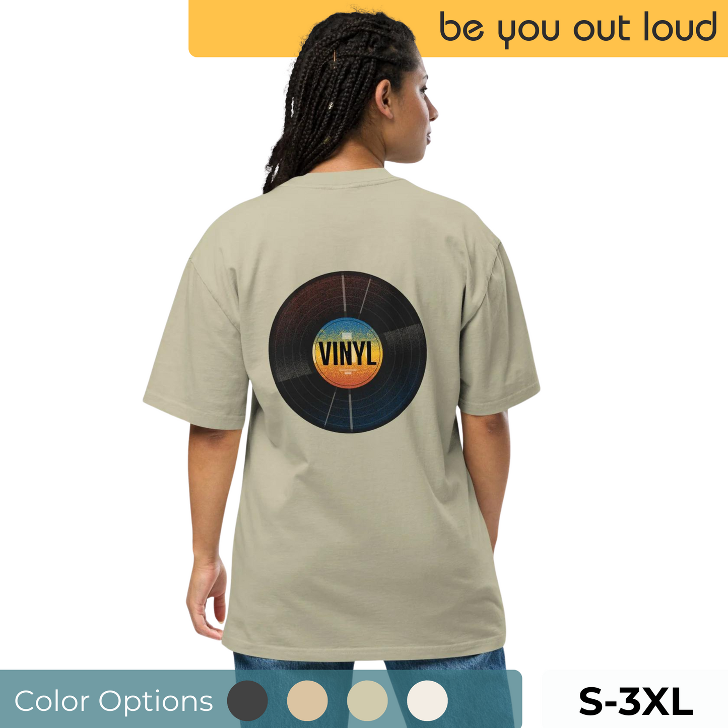 Rear view of a woman in a Be You Out Loud khaki oversized tee featuring a central, detailed vinyl record design, hinting at a classic vibe in sizes S-3XL, with additional color options showcased below.