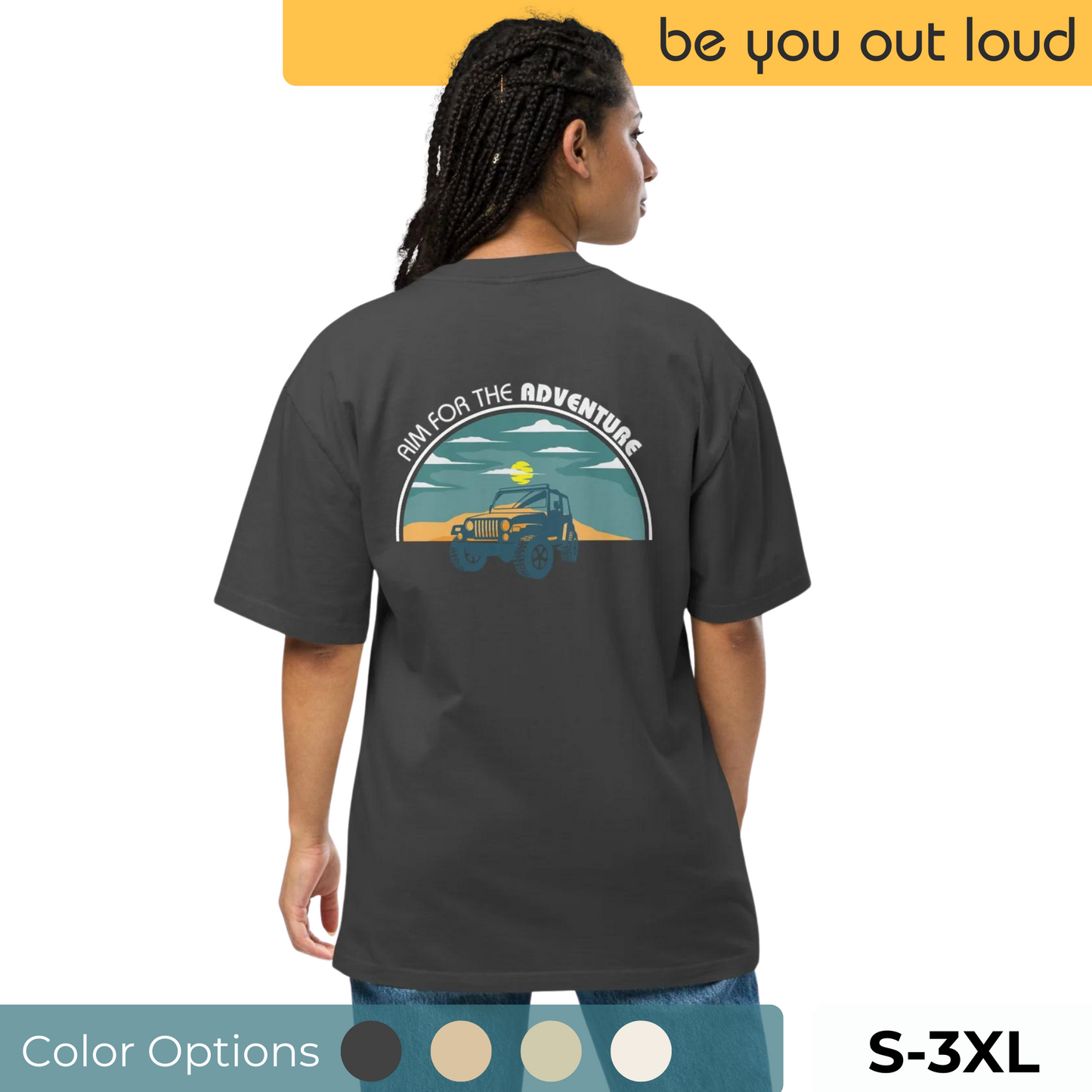 Back view of a woman wearing a Women's Quirky Adventure Oversized Graphic Tee in charcoal, featuring a retro jeep and sunset design with "Aim for the Adventure" slogan, available in sizes S-3XL with color options displayed below.