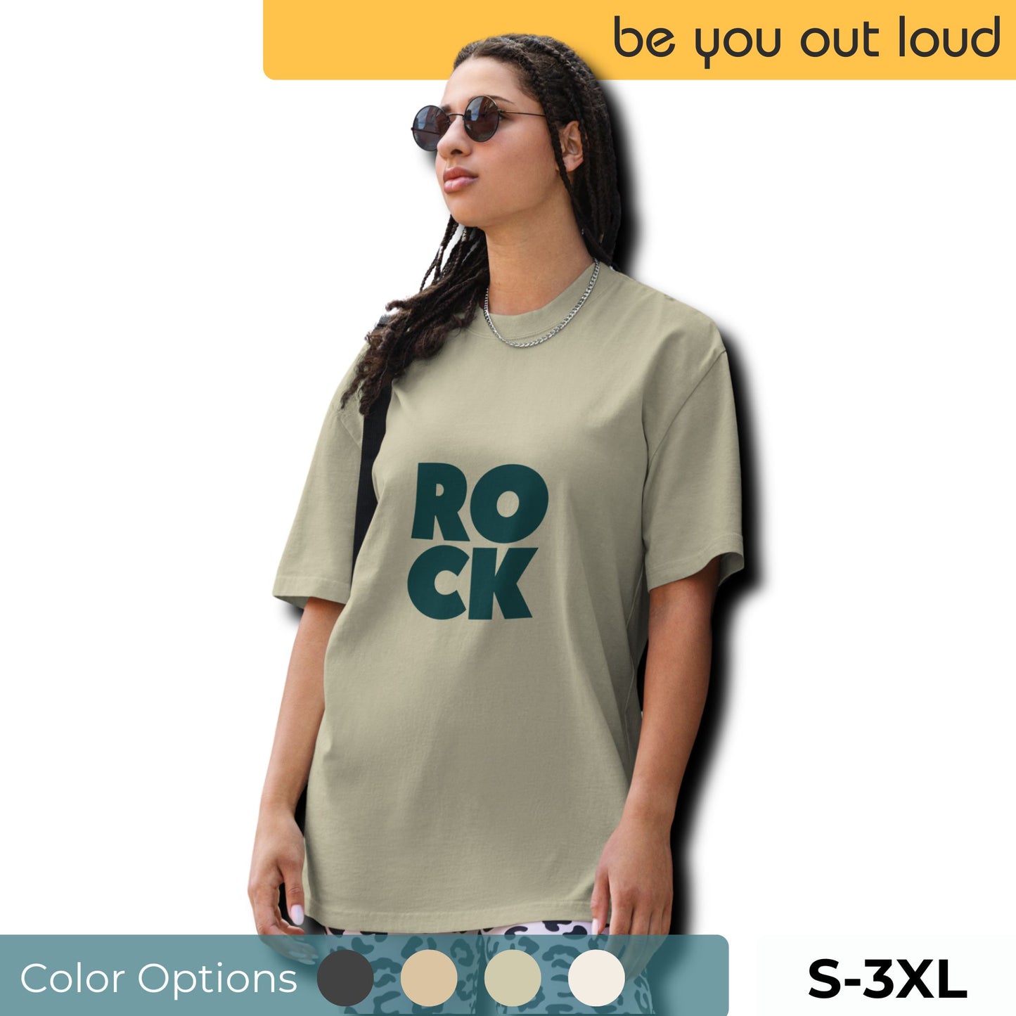 A fashionable woman models the Women's 'ROCK' Bold Letter Oversized Tee in an earthy taupe shade, paired with trendy accessories, showcasing a modern take on rock apparel. Available in sizes S-3XL, with additional color options indicated below.