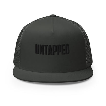 A sophisticated all-black 5-panel trucker cap with embossed "UNTAPPED" lettering on the front, featuring a mesh back for breathability and an adjustable snapback closure for the perfect fit.