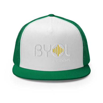 White and green 5-panel trucker hat with "BYOL a mindset" embroidered on the front in white and yellow, displayed against a clean background. Available in various colors: gray, maroon, white and blue, blue, and teal.