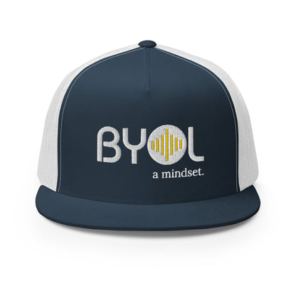 Blue and white 5-panel trucker hat with "BYOL a mindset" embroidered on the front in white and yellow, displayed against a clean background. Available in various colors: gray, maroon, white and blue, blue, and teal.