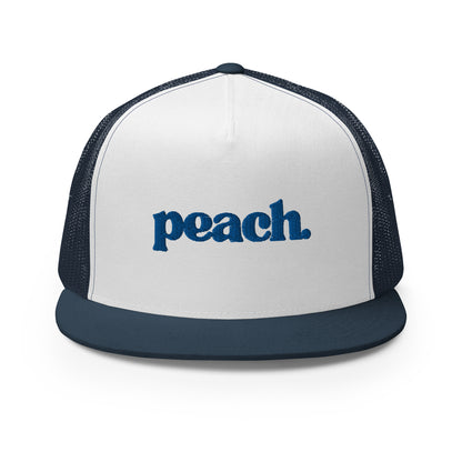 A white and navy blue 5-panel trucker cap with "peach" written in striking blue script across the front, featuring breathable mesh backing and a classic snapback closure.