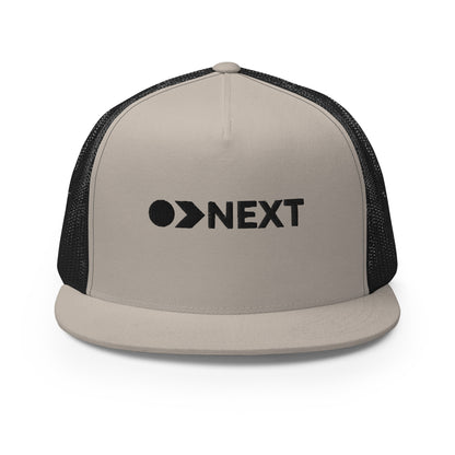 A khaki and black 5-panel trucker cap with a dark, embossed "NEXT" logo on the front, featuring a breathable mesh back and a flat bill, designed for trendsetters and go-getters.