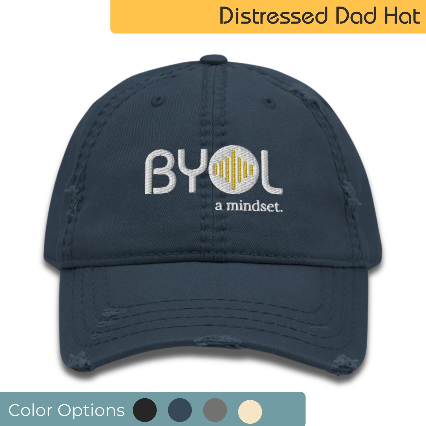 Navy blue distressed dad hat with "BYOL a mindset" embroidered on the front in white and yellow, displayed against a clean background. Available in various colors: black, navy blue, gray, green, and beige.