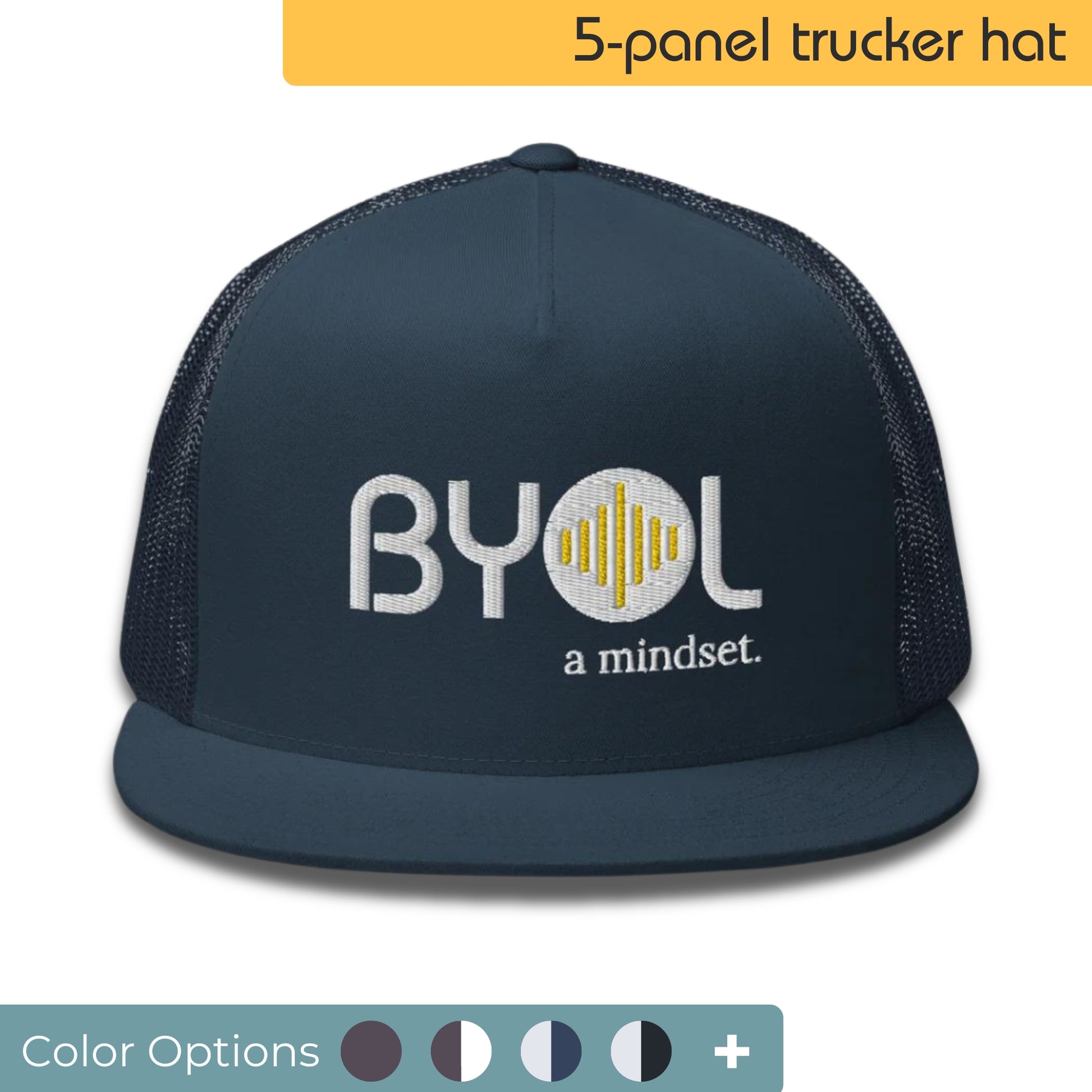 Navy blue 5-panel trucker hat with "BYOL a mindset" embroidered on the front in white and yellow, displayed against a clean background. Available in various colors: gray, maroon, white and blue, blue, and teal.