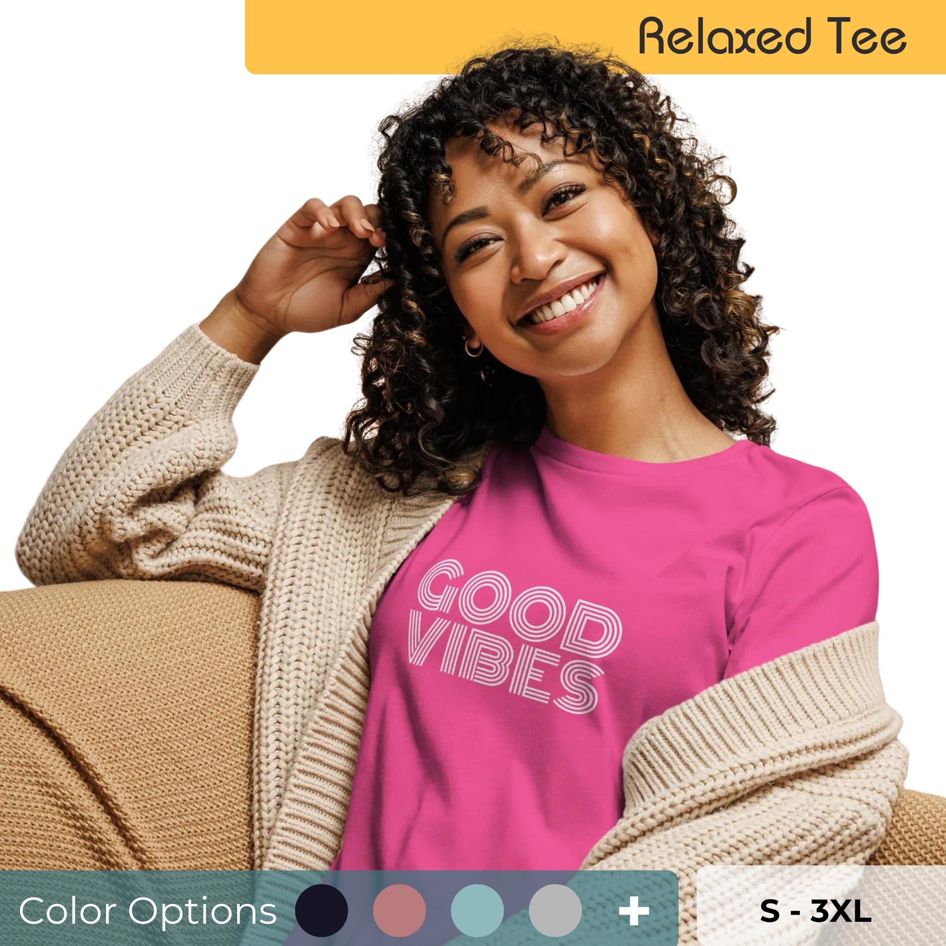 Radiant woman with curly hair wearing a vibrant pink relaxed tee with 'Good Vibes' in white letters, paired with a beige cardigan, available in multiple colors, sizes S-3XL