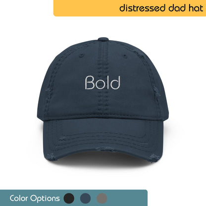 Black baseball cap with the word "BOLD" embroidered in white on the front. Text "Distressed Dad Hat" is written above the image, and "Color Options+" is written below the image.