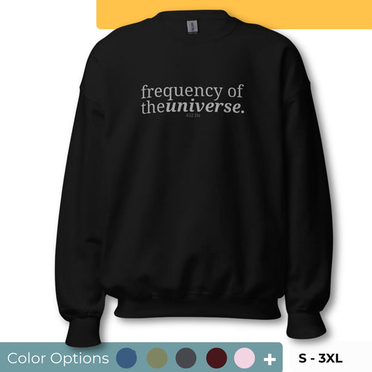 Black sweatshirt with the phrase "frequency of the universe. 432 Hz" printed on the front, available in color options navy blue, green, maroon, gray, and pink, available in sizes S to 3XL.