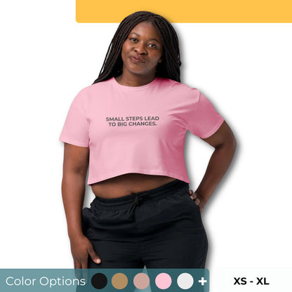 Women’s Loose-Fit Crop Top with "Small steps lead to big changes" slogan in various colors and sizes, XS to XL.