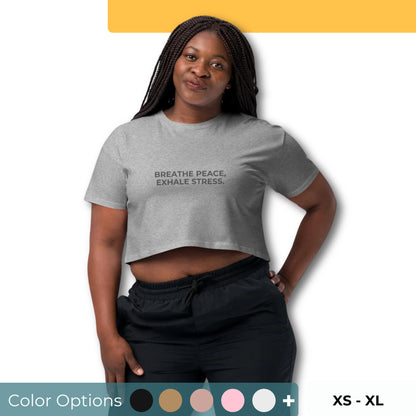 Women’s Loose-Fit Crop Top with "Breathe peace, exhale stress" slogan in various colors and sizes, XS to XL.