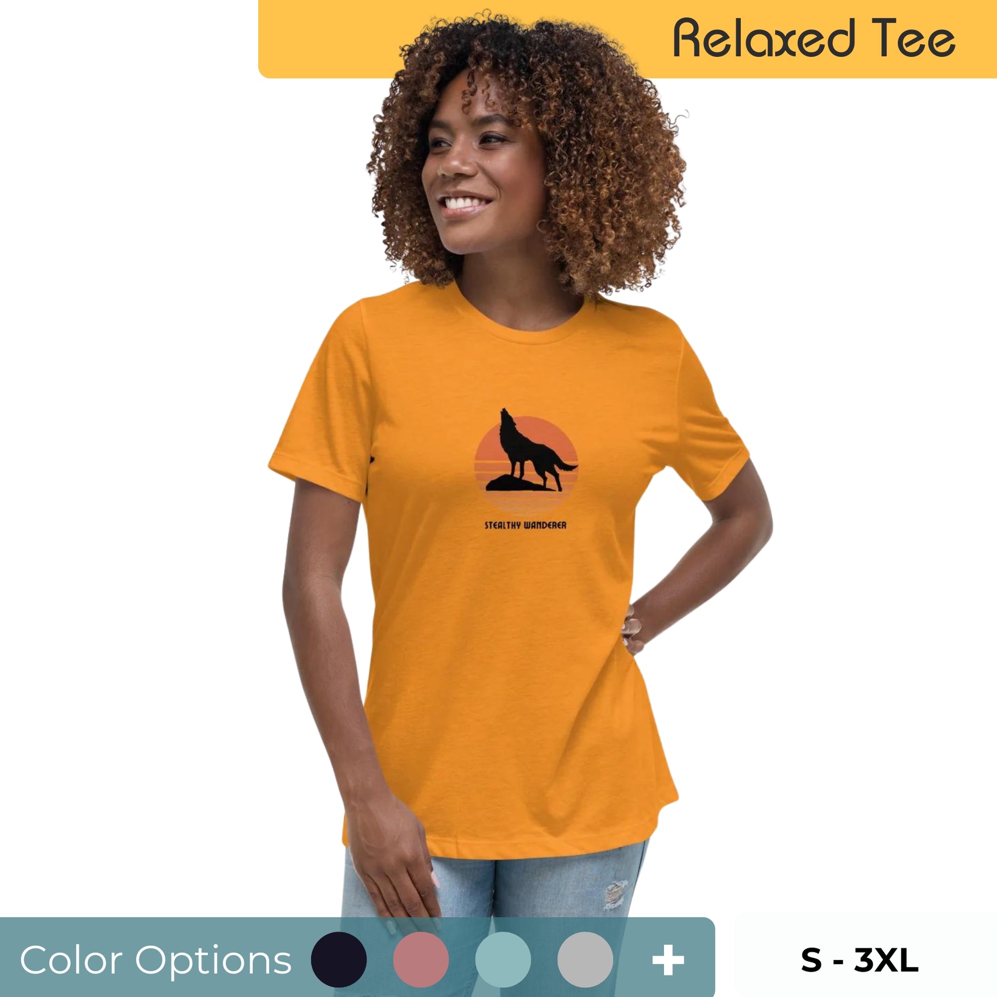 Joyful woman with curly hair wearing a mustard yellow relaxed tee featuring a 'Stealthy Wanderer' graphic with a silhouette of a wolf against a sunset, available in multiple colors, sizes S-3XL