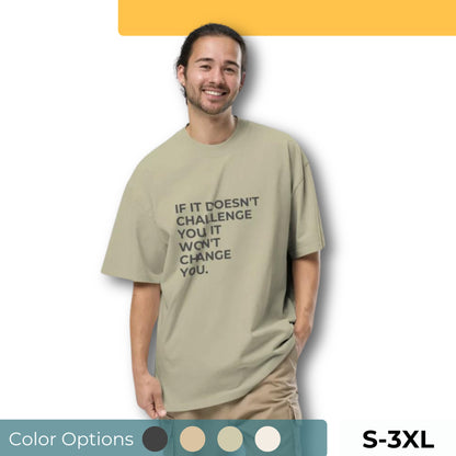 Man wearing an oversized faded tee in light beige with "If It Doesn’t Challenge You, It Won’t Change You" text. Available in multiple colors and sizes S-3XL.