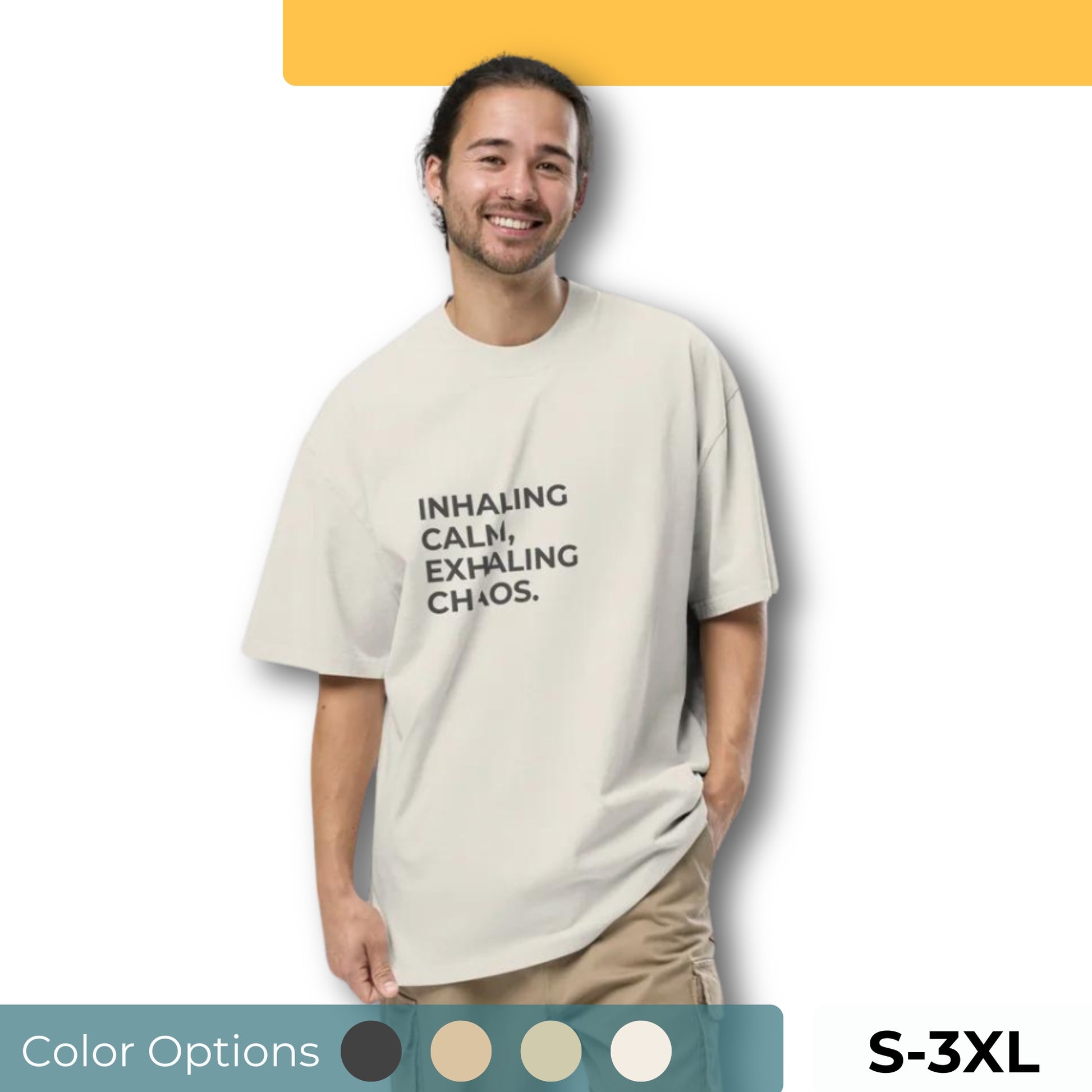 Man wearing an oversized faded tee in off-white with "Inhaling Calm, Exhaling Chaos" text. Available in multiple colors and sizes S-3XL.