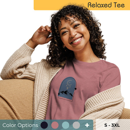 Woman wearing a relaxed tee with a tranquil night sky graphic design, representing comfortable and authentic fashion by BYOL. Showing multiple color and size options