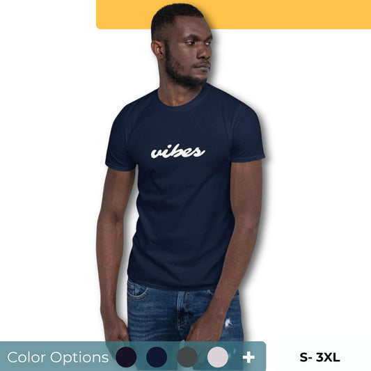 A man appears contemplative, wearing a heather heather grey t-shirt with the word "vibes" written in cursive white lettering on the front. Below the image, a collection of color swatches suggests additional t-shirt color options, and the inscription "SIZES: S-3XL" indicates the range of available sizes.