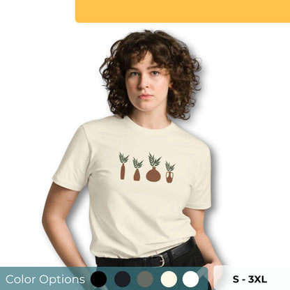 Woman wearing a beige t-shirt with abstract plant designs and color options in black, navy blue, green, gray, and white, available in sizes S to 3XL.