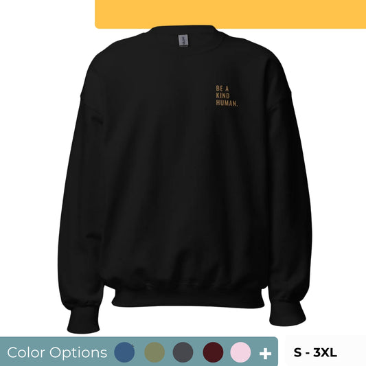 Black "Be A Kind Human" premium crew neck sweatshirt with ribbed cuffs, soft fleece lining, and comfortable fit, available in multiple colors and sizes.