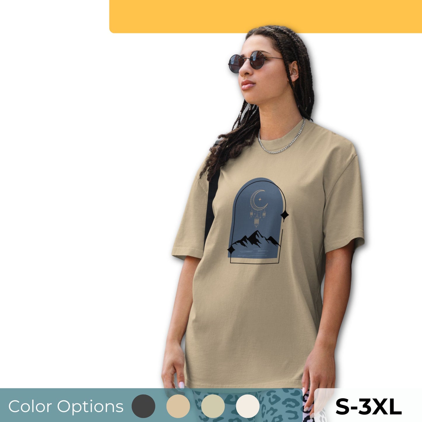 Woman wearing an oversized faded tee with a dreamy mountain night design, showcasing unique self-expression and bold fashion, available in multiple colors and sizes S-3XL.