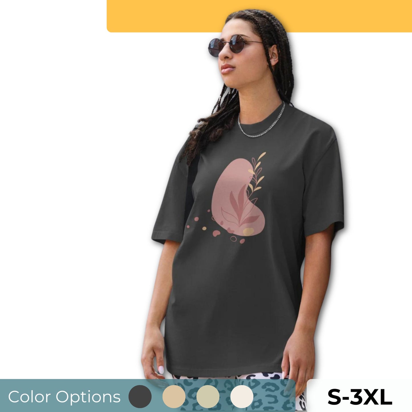 Woman wearing a black oversized faded tee with a bold heart design, showcasing self-expression and fearless fashion showing multiple color options and sizes s-3xl