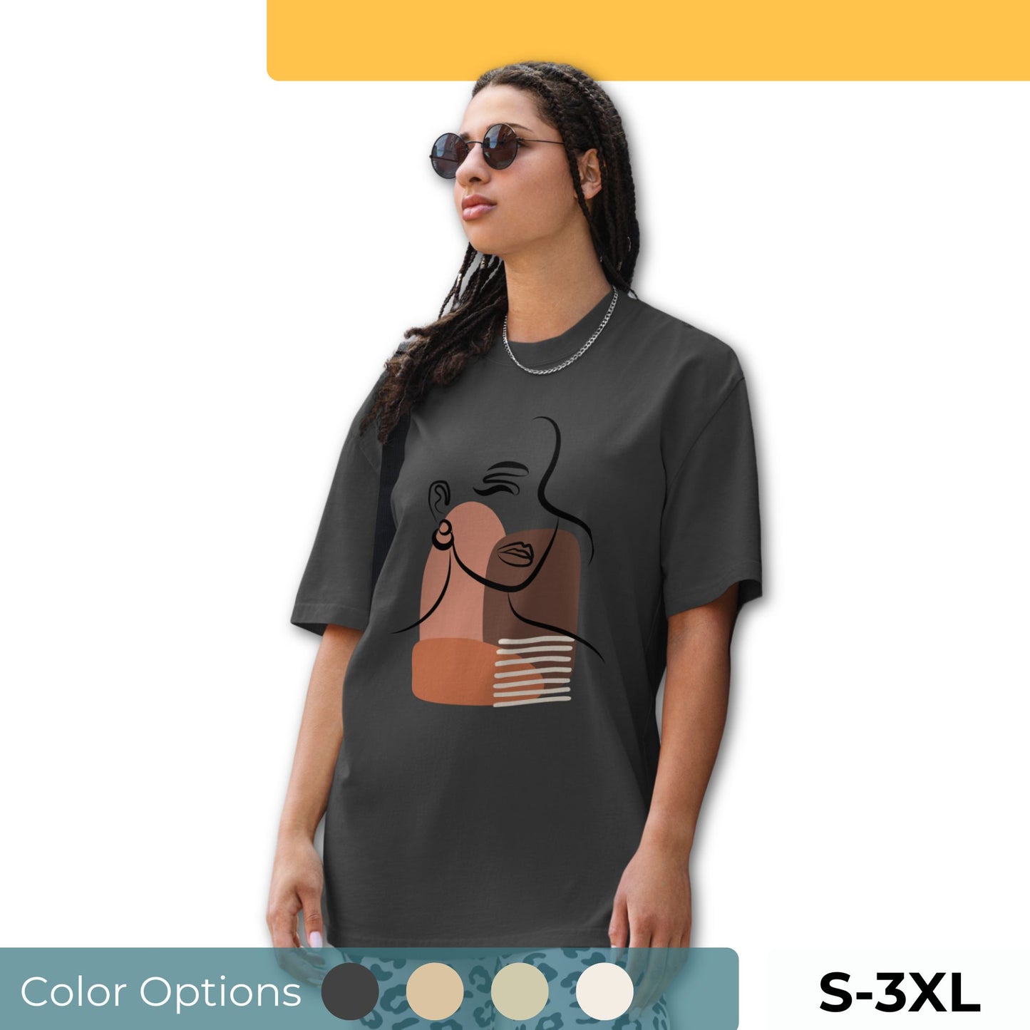 Woman wearing an oversized faded tee with an abstract empowered woman design, highlighting unique self-expression and bold artistic fashion, available in multiple colors and sizes S-3XL.