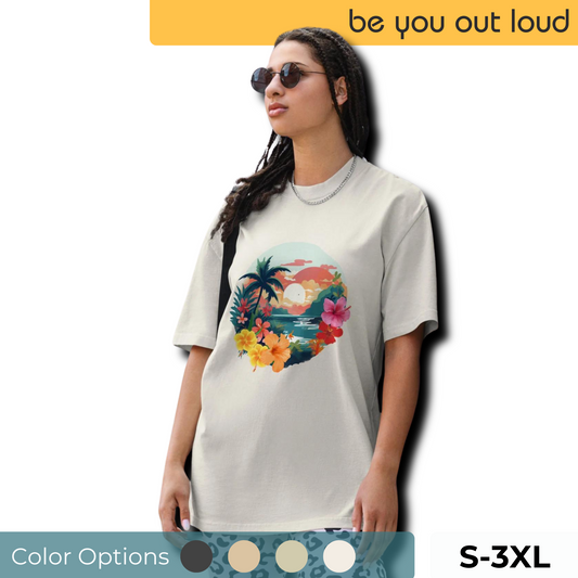 Fashion-forward woman in a Women's Tropical Sunset faded bone Oversized Tee featuring a vibrant, artistic print of palm trees and flowers, paired with statement leopard print pants and chic sunglasses, encapsulating a fresh, summery aesthetic. Available in sizes S-3XL.