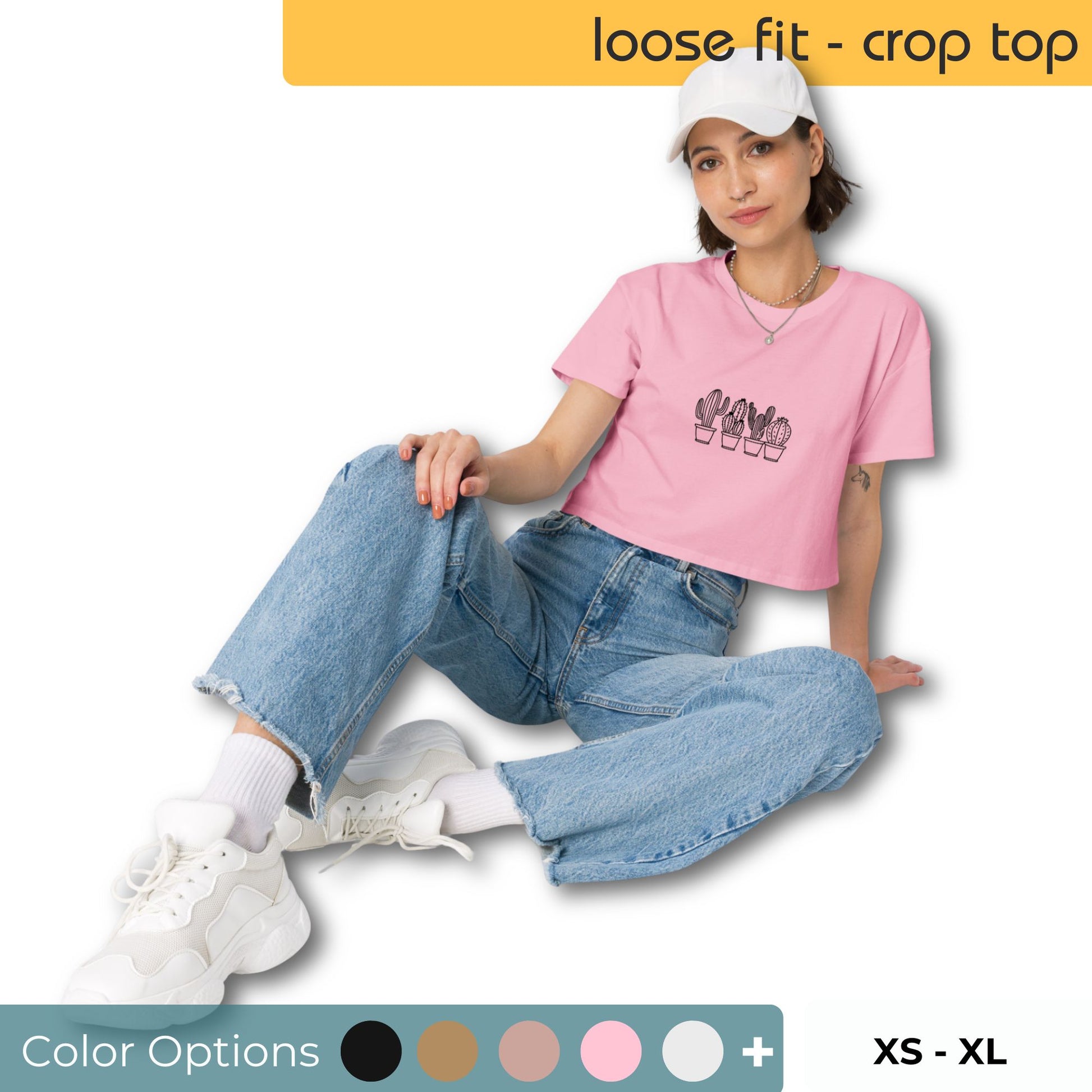 Woman wearing a loose-fit crop top with a subtle cactus graphic design, embodying comfortable and authentic fashion by BYOL. showing multiple color options available and xs-xl available