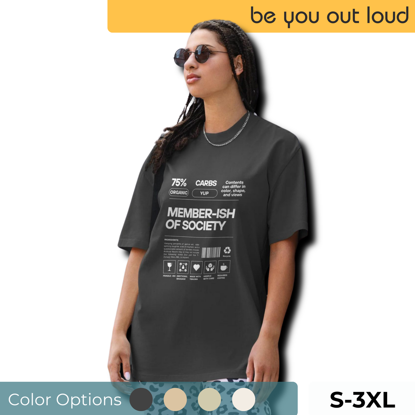 A woman models a Women's 'Member-ish of Society' faded black Oversized Tee, featuring a humorous, nutrition-fact-style graphic. Tee is paired with a subtle chain necklace and cool sunglasses, adding a touch of irony to casual wear. Available in sizes S-3XL with multiple color options below.