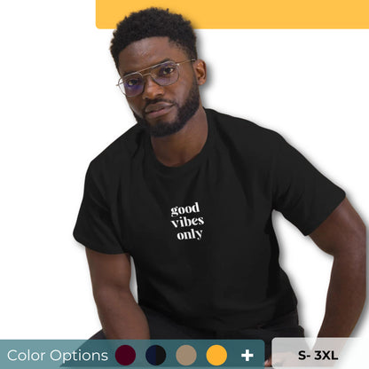 Man wearing a maroon classic tee with 'good vibes only' text, a testament to a lifestyle of positivity and authentic personal expression. Showing the color and size options