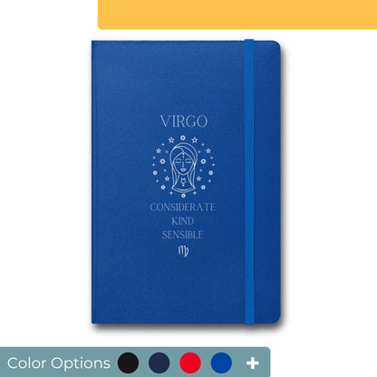 Royal blue notebook with elastic band featuring a white Virgo zodiac design on the cover, including an illustration of a woman’s face within a circle of stars and the text 'Considerate, Kind, Sensible' highlighting Virgo traits.