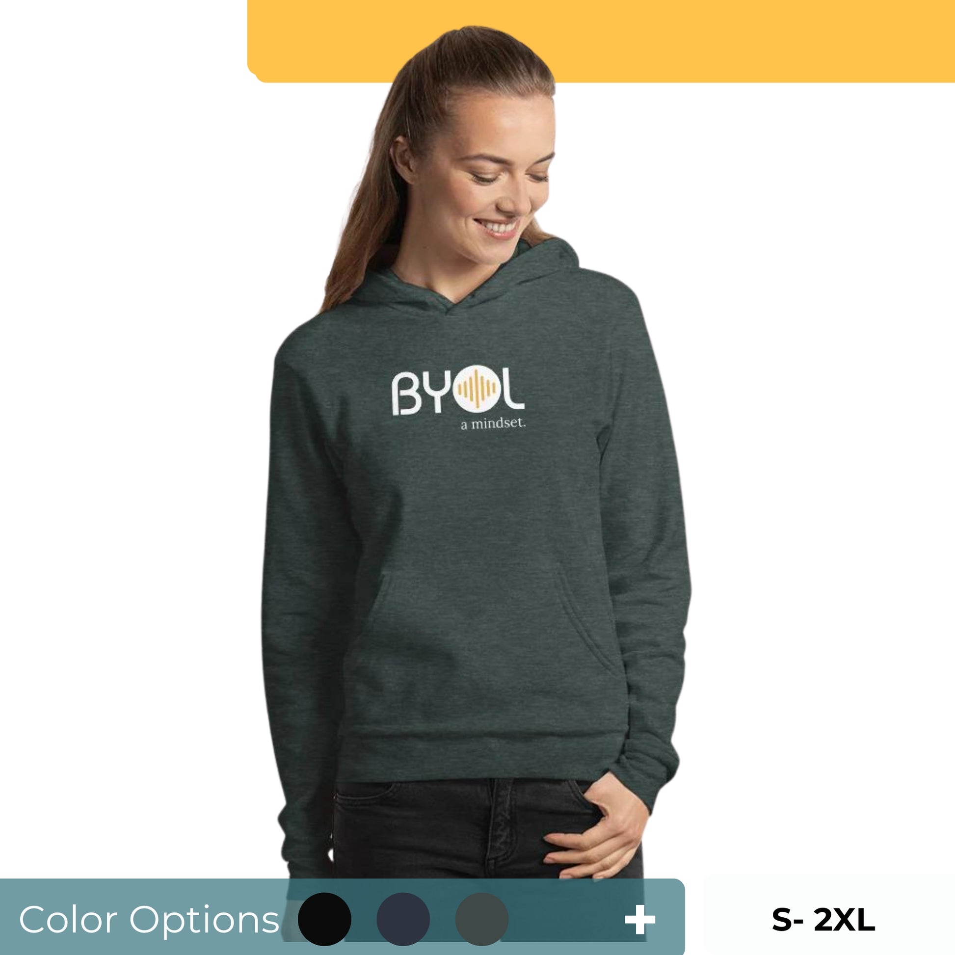 Woman wearing a green BYOL mindset hoodie with color options in black, navy blue, and gray, available in sizes S to 2XL.