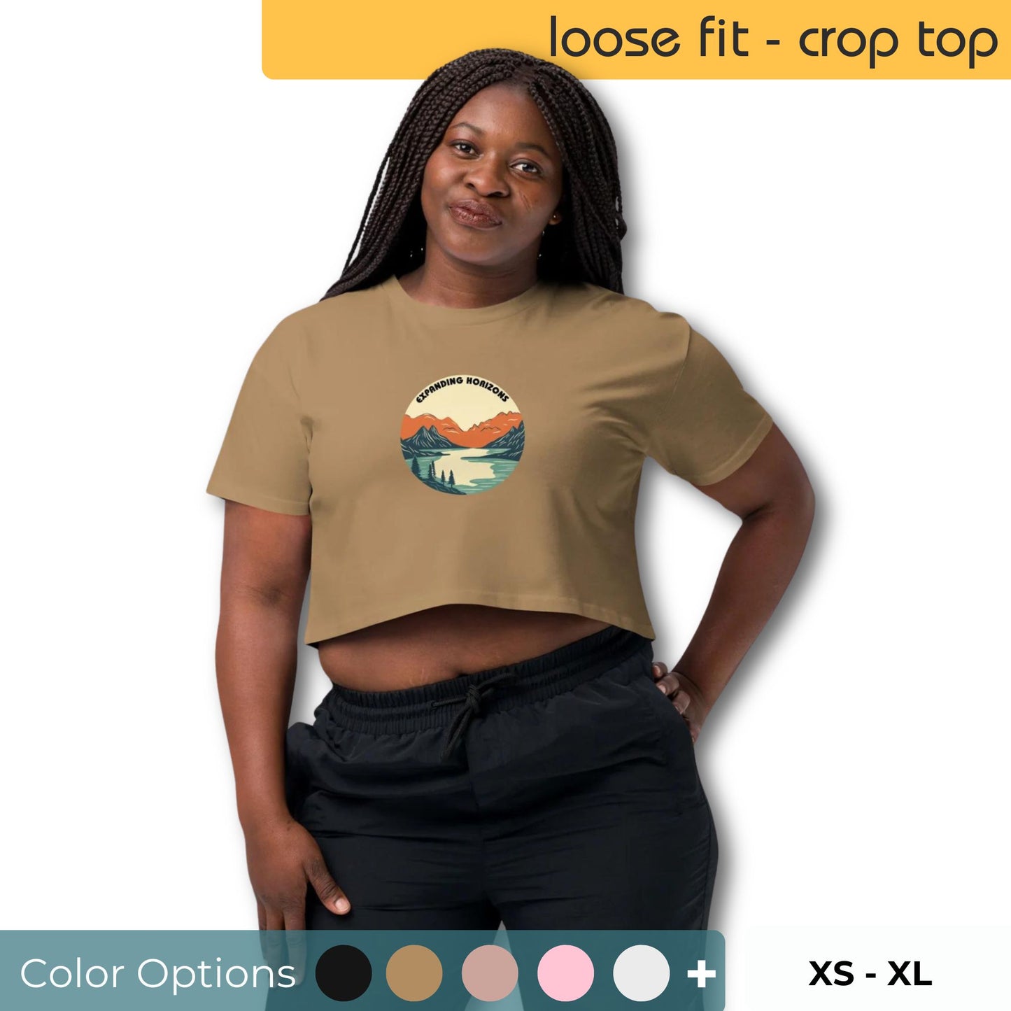 Woman in a loose-fit, bravery-themed brown crop top with a mountain sunset graphic, available in sizes XS through XL.