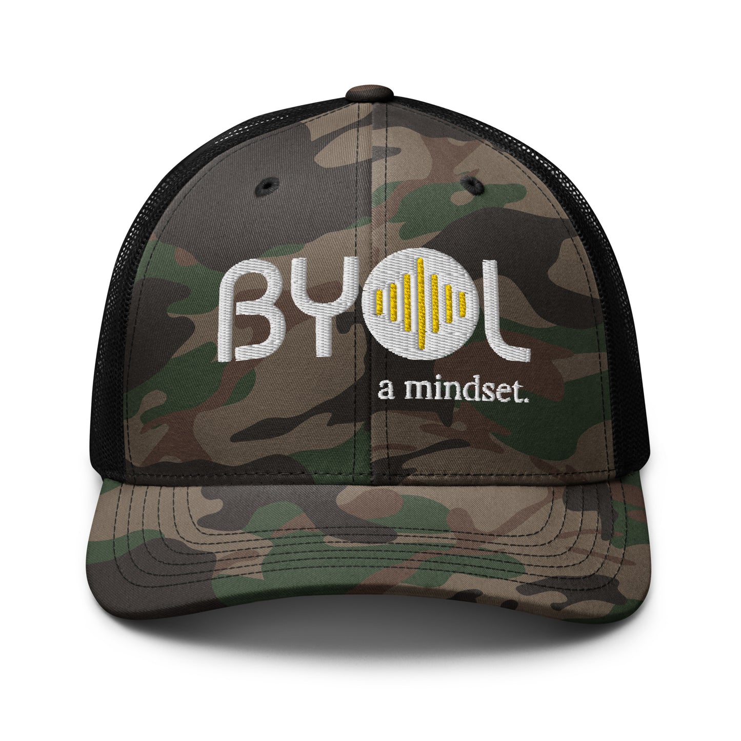 Camo/black camouflage retro trucker hat with "BYOL a mindset" embroidered on the front in white and yellow, displayed against a clean background. Available in various colors: black, brown, green, and beige.