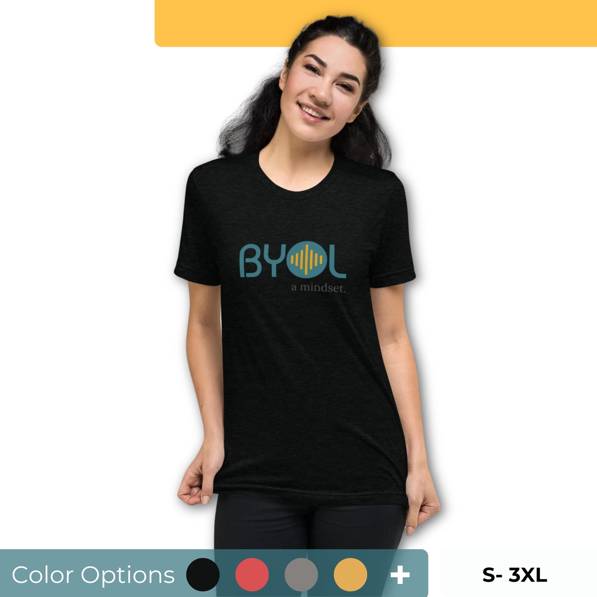 Woman wearing a black BYOL mindset t-shirt with color options in black, red, pink, gray, and yellow, available in sizes S to 3XL.