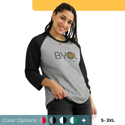 Woman wearing a gray and black BYOL mindset raglan t-shirt with color options in red, black, white, and green, available in sizes S to 3XL.