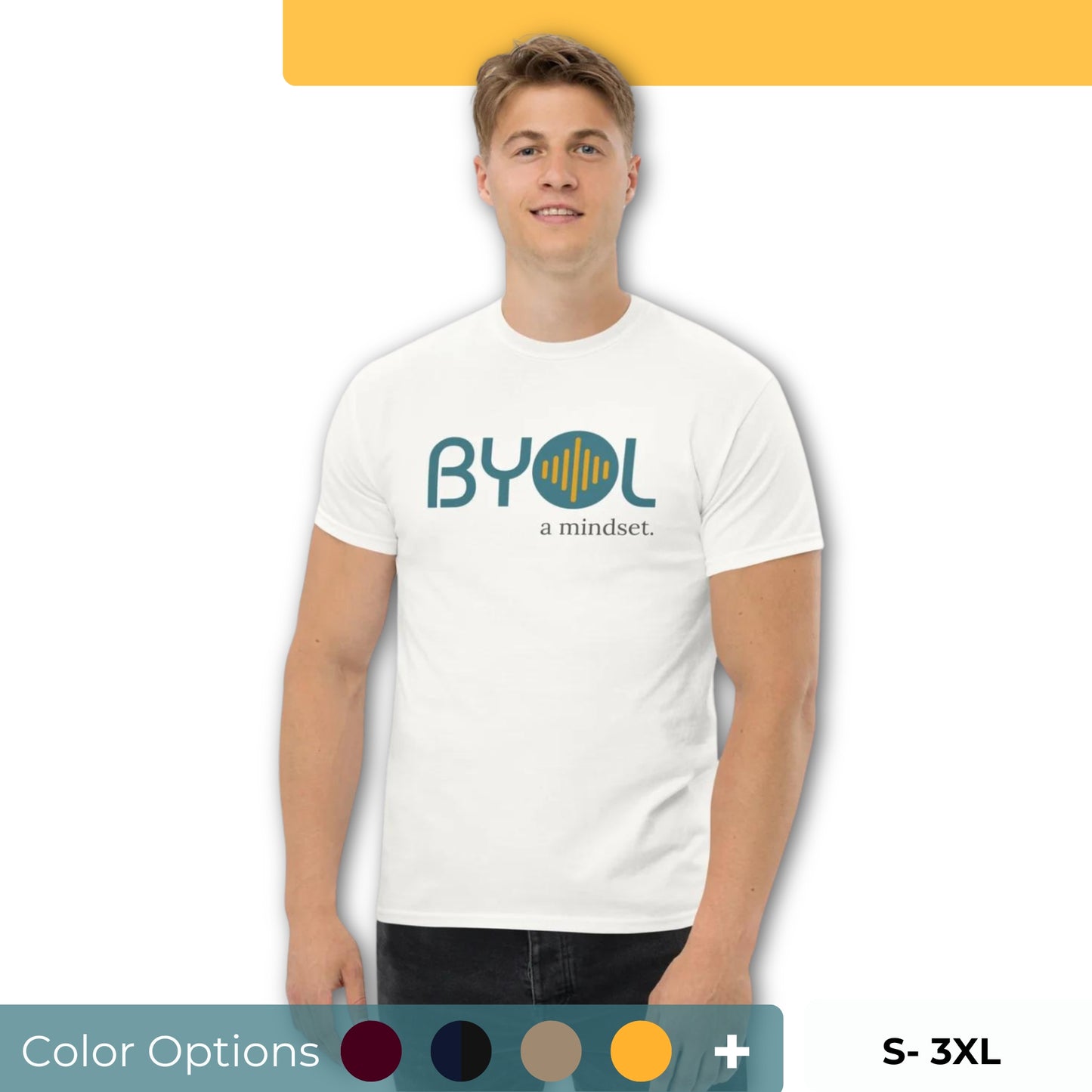 A young man with short blonde hair wearing a white "BYOL: a mindset" T-shirt, smiling and standing with his arms at his sides. The T-shirt features the "BYOL" logo in teal and yellow on the front and is available in multiple colors (maroon, black, brown, gold, plus more) and sizes (S-3XL). The "be you out loud" logo is displayed at the top.