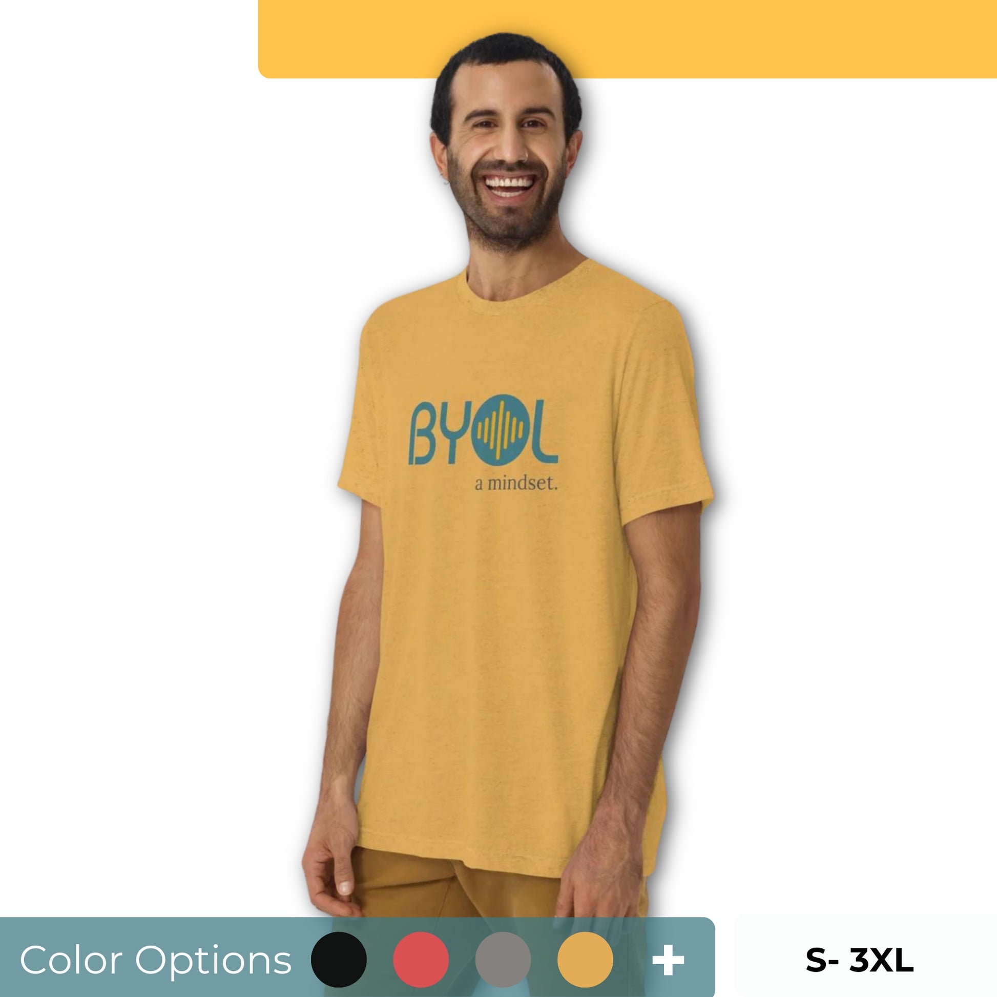 A young man with short dark hair and a beard wearing a yellow "BYOL: a mindset" T-shirt, smiling and standing with his arms at his sides. The T-shirt features the "BYOL" logo in teal and is available in multiple colors (black, red, gray, pink, yellow, plus more) and sizes (S-3XL). The "be you out loud" logo is displayed at the top.