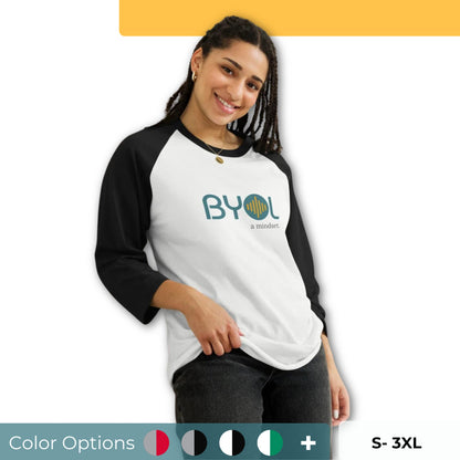 Woman wearing a black and white BYOL mindset raglan t-shirt with color options in red, black, gray, and green, available in sizes S to 3XL.