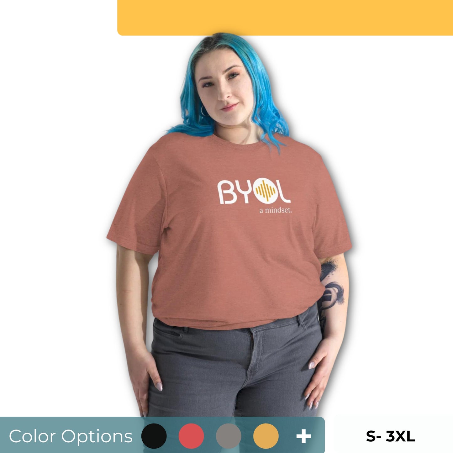 Woman wearing a loose fit BYOL mindset t-shirt in brown with color options in black, red, pink, gray, and yellow, available in sizes S to 3XL.