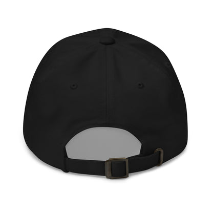 The image shows the back view of a black dad hat featuring an adjustable strap with a metal buckle for sizing.