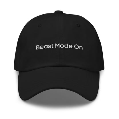 A black dad hat with the phrase "Beast Mode On" embroidered in white stitching across the front.