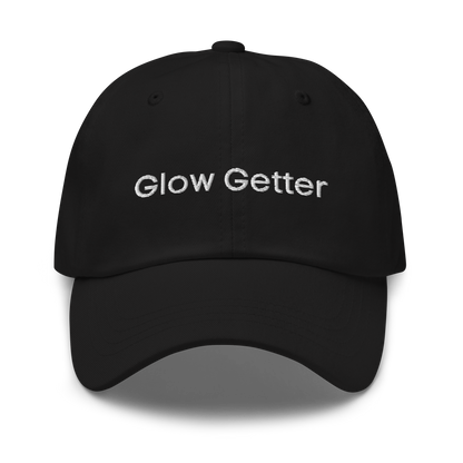 Black baseball cap with white embroidered text 'Glow Getter' on the front.