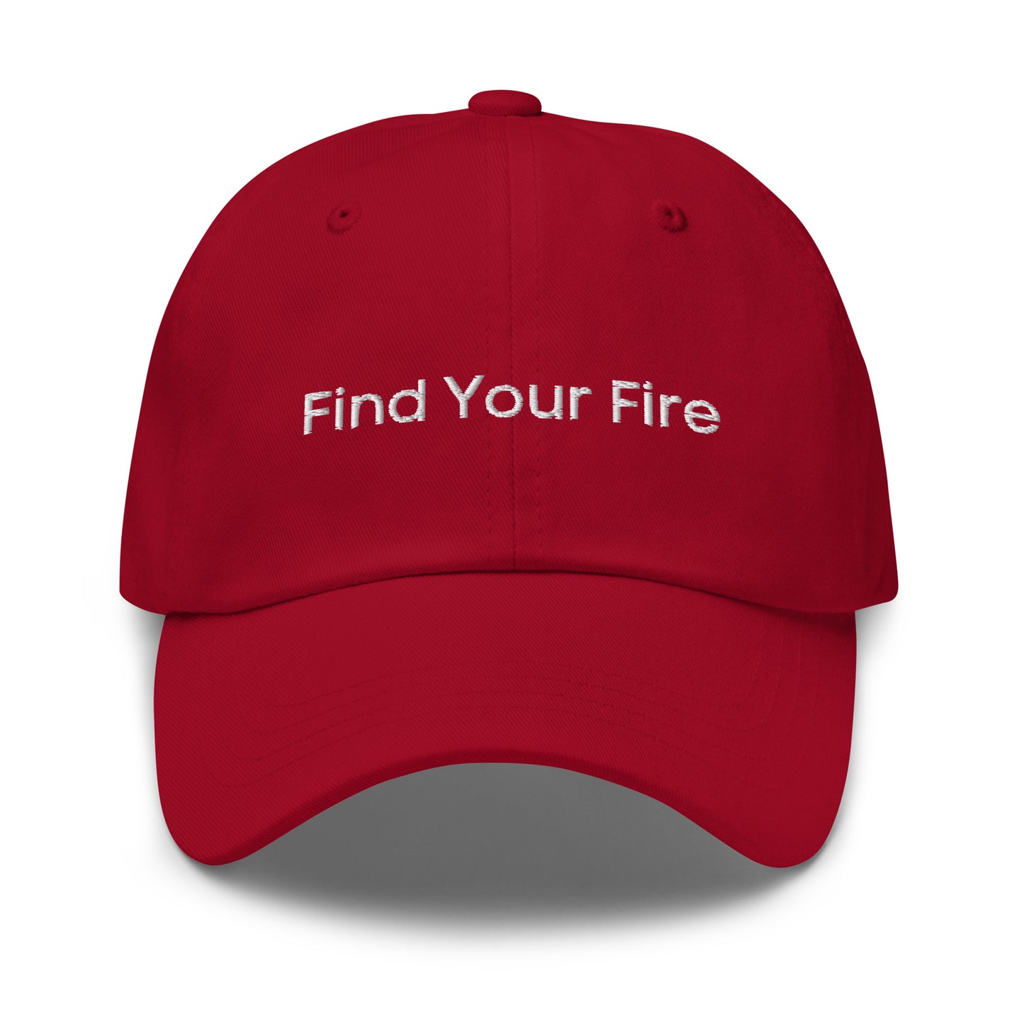 A red dad hat with the phrase "Find Your Fire" embroidered in white stitching across the front.