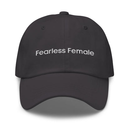 A dark grey dad hat with the phrase "Fearless Female" embroidered in white stitching across the front.