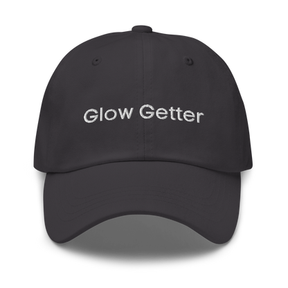 Dark grey baseball cap with white embroidered text 'Glow Getter' on the front.