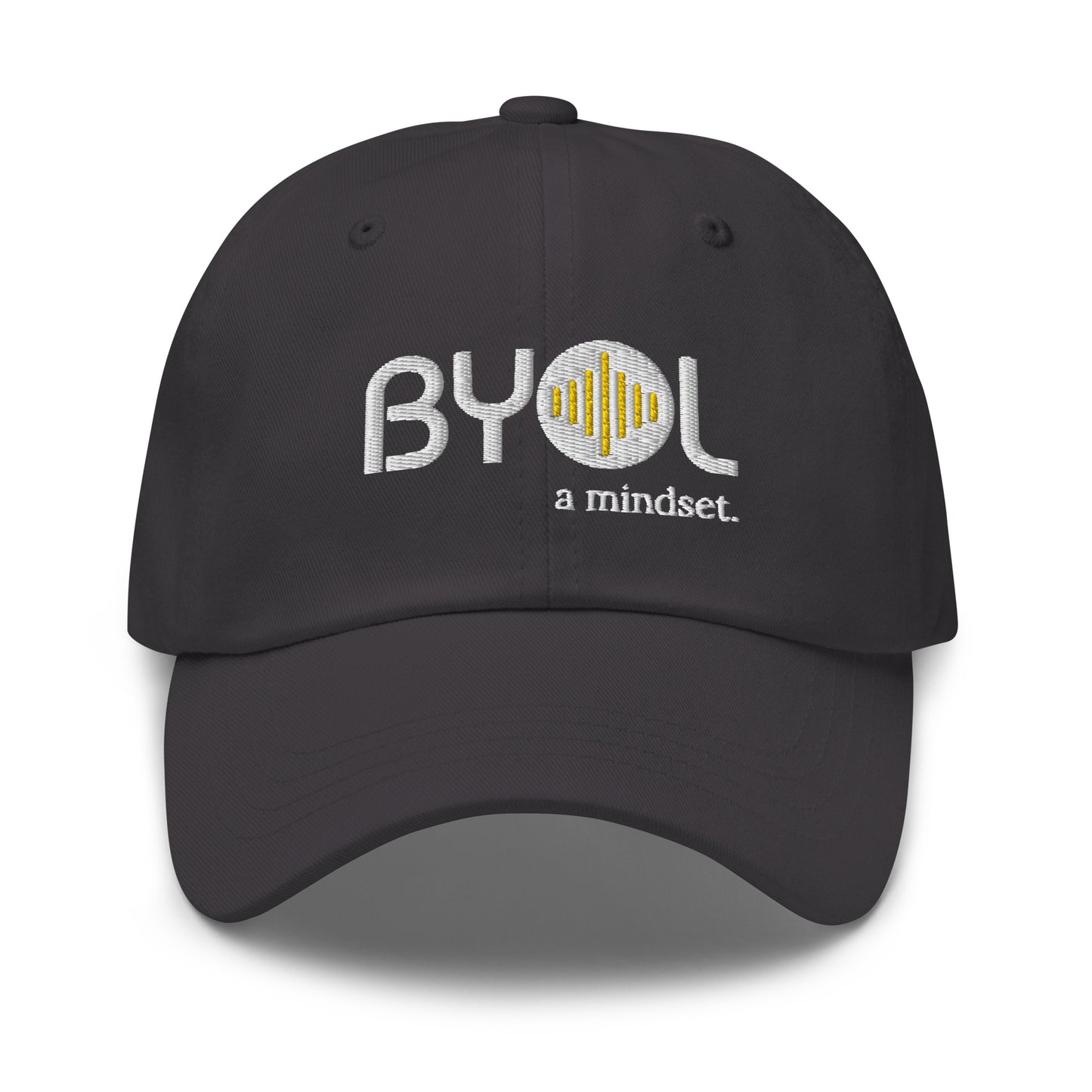 Dark grey classic dad hat with "BYOL a mindset" embroidered on the front in white and yellow, displayed against a clean background. Available in various colors: black, gray, green, pink, and tan.